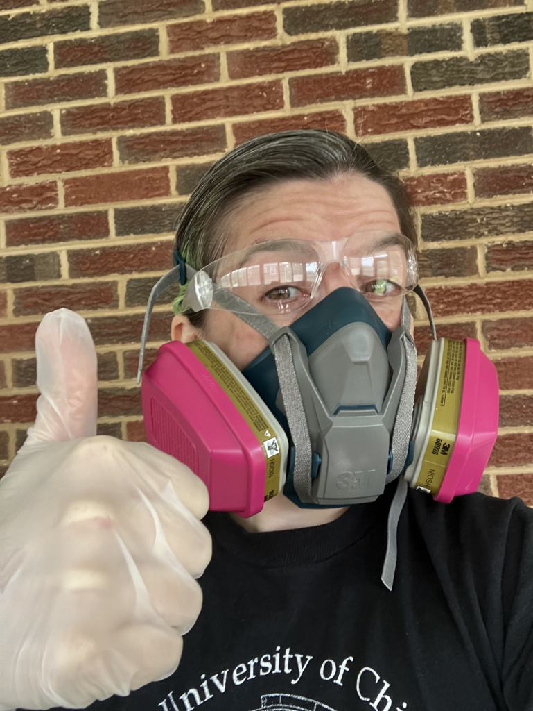 Selfie photo of me giving the camera a thumbs-up while wearing a respirator, latex gloves, and eye protection